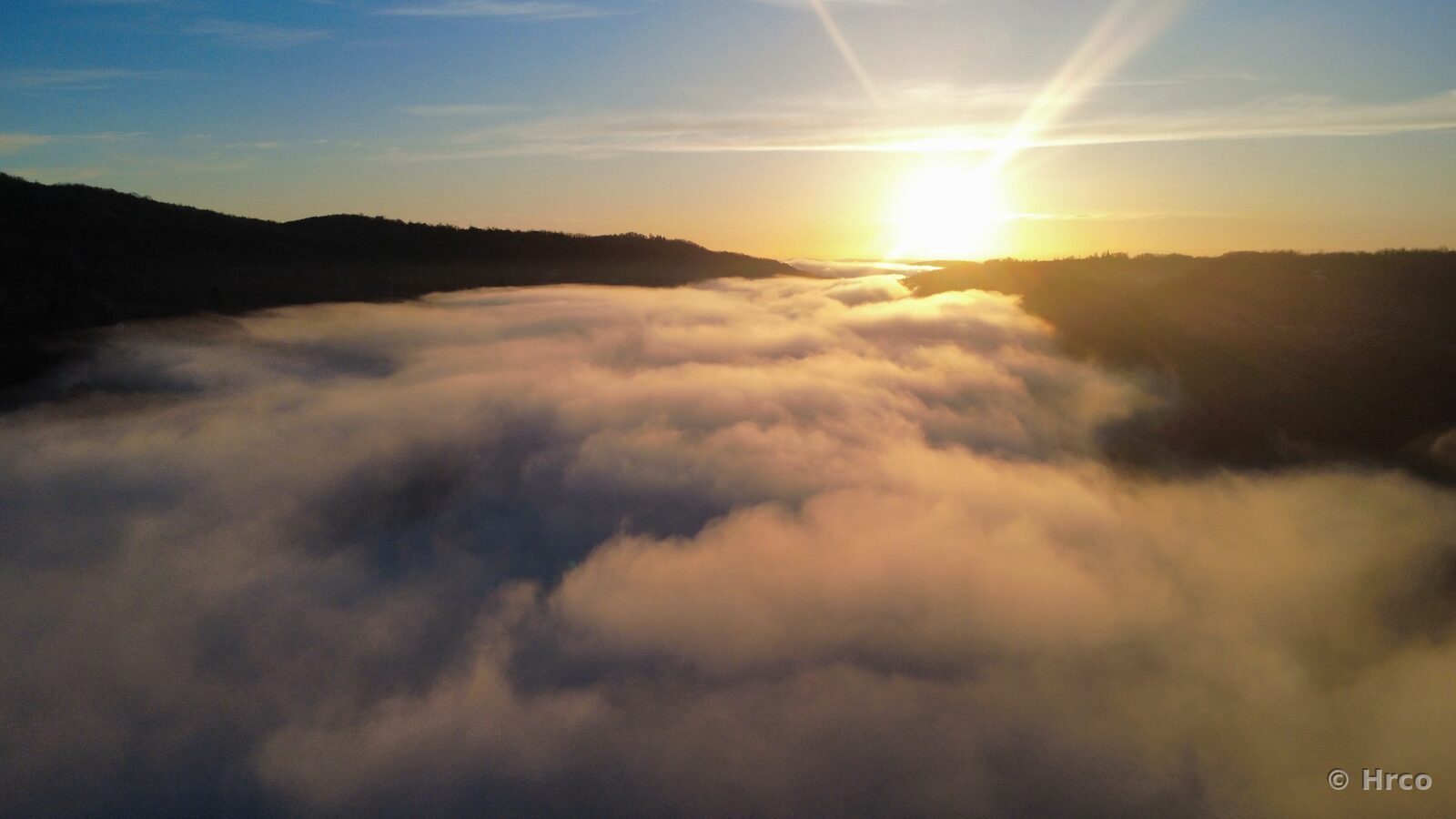 Sun breaking through mist